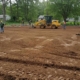 Выравнивание земли для устройства садовой зоны